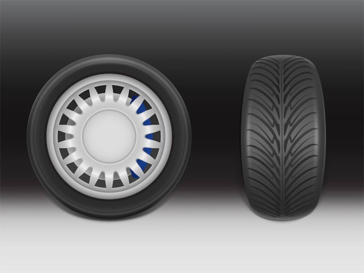 A side-by-side view of a car tire: one side shows a white hubcap, and the other displays a sleek, treaded black tire.