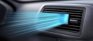 Airflow visualization from a car's vent, illustrating cool air streaming out in vibrant blue lines against a dark dashboard background.